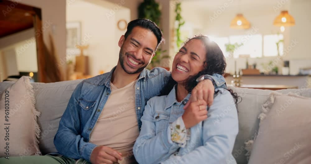 Wall mural Love, couple and laughing with hug on couch in home for funny conversation, bonding and commitment in marriage. People, lens flare or happy on sofa with comic joke, embrace or romance in relationship