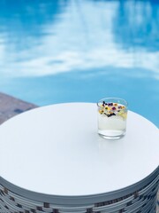 Floral cocktail by pool 