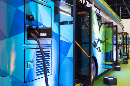 Electric bus vehicle with electric charging interface.