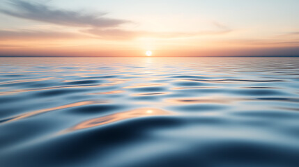 Obraz premium Gentle ripples across a glassy surface of water, with a soft gradient sky reflecting subtle hues of dawn, creating a tranquil and meditative scene with smooth textures 