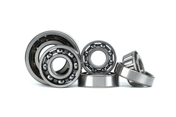 Set of metal ball bearings in various sizes isolated on a white background
