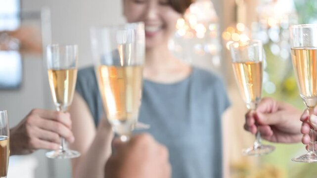 Image of toasting with champagne and wine glasses Animation of close-up of hands without face