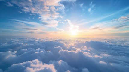Blue sky with some clouds at sunrise, overlooking clouds.