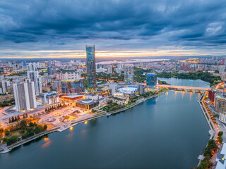 Obraz premium Yekaterinburg city with Buildings of Regional Government and Parliament, Dramatic Theatre, Iset Tower, Yeltsin Center, panoramic view at summer sunset.