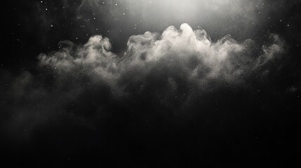 Abstract white dust particles exploding on a black background.