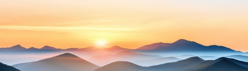 Fototapeta premium A breathtaking sunrise over tranquil mountains, casting warm hues across the sky and illuminating the serene landscape below.