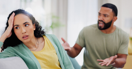 Angry, affair and couple with argument on sofa in living room for divorce, cheating or breakup....