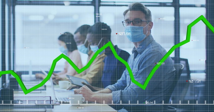 Image of financial data processing over diverse businesspeople in face masks in office