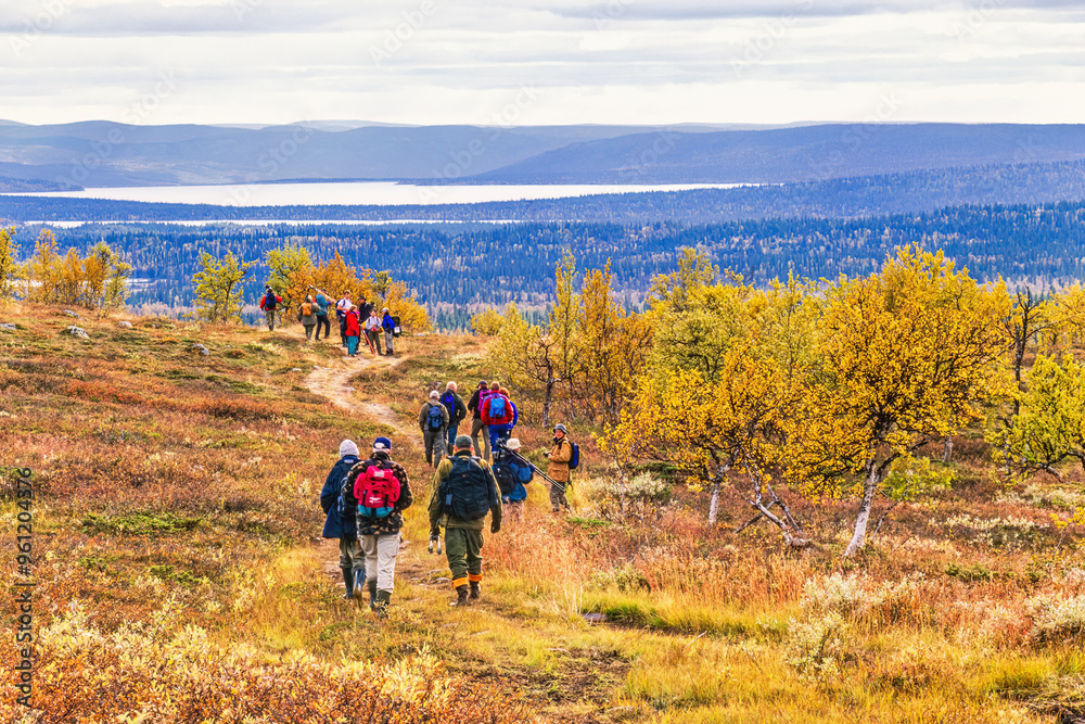 Sticker People walking in high country in a beautiful autumn landscape