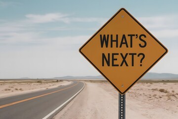 A photo of a yellow road sign with the text WHAT'S NEXT placed on a windy desert road.
