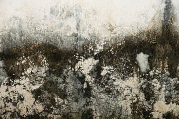 A wall with a lot of dirt and grime on it