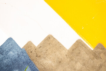 A painting of mountains with a yellow stripe. The painting is abstract and has a sense of depth