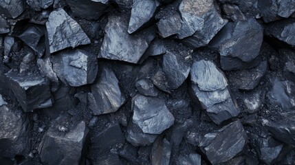 Detailed closeup view of dark coal stones rock textures. Background for banner, backdrop or texture