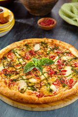 Margherita Pizza with Pesto Sauce - Fresh Italian Cuisine with Herbs and Tomatoes