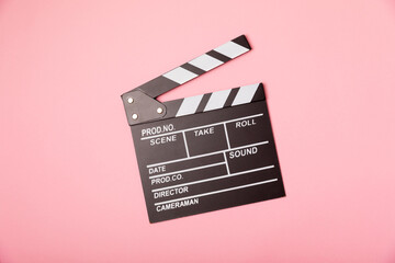 Naklejka premium Movie clapper. Movie clapperboard on a bright colored background. Concept of rest and entertainment. Concept of cinema. Film director. Producer. Business and profession. Place for text. Copy space