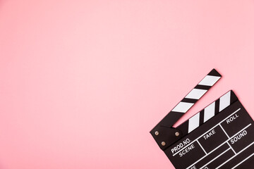 Movie clapper. Movie clapperboard on a bright colored background. Concept of rest and...