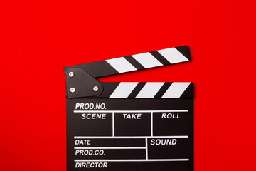 Fototapeta premium Movie clapper. Movie clapperboard on a bright colored background. Concept of rest and entertainment. Concept of cinema. Film director. Producer. Business and profession. Place for text. Copy space