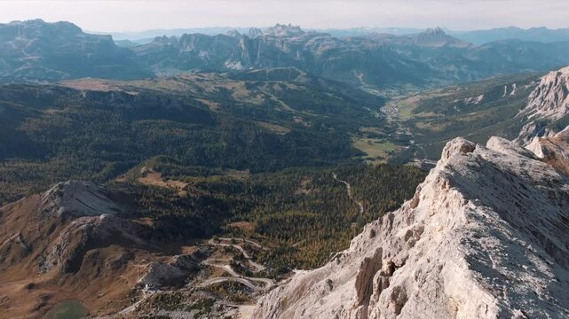 Aerial view of mountain peaks during sunrise in the Dolomites, Italy