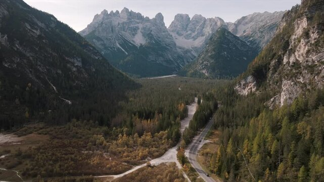 Aerial view of mountain peaks during sunrise in the Dolomites, Italy