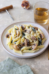 Penne pasta with mushrooms, spinach and cheese. Healthy food. Vegetarian food.