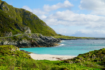 Scenic turquoise cove with cliffs along Norwegian Scenic Route Andøya