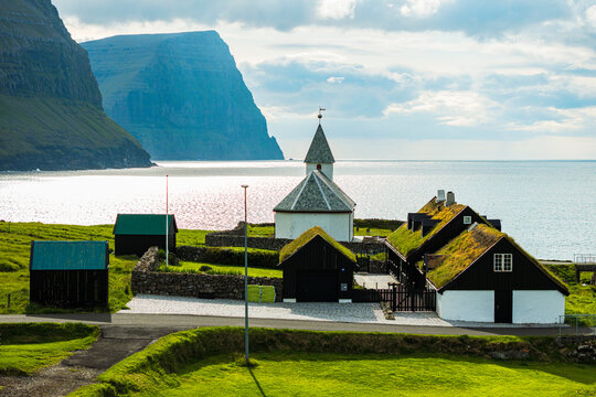 Church of Vidareidi overlooking a fjord, Faroe Islands