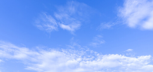 Beautiful blue sky with strange shape of clouds in the morning or evening used as natural background texture in decorative art work