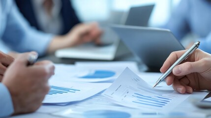 Business meeting, close-up of hand analyzing graphs