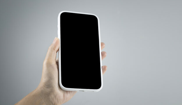 Mobile phone, cell phone smarfone in hand black screen empty copy space.