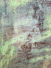 Vintage old rusty metal wall, grunge peeling paint, paint strokes, rust stains, old vintage green background