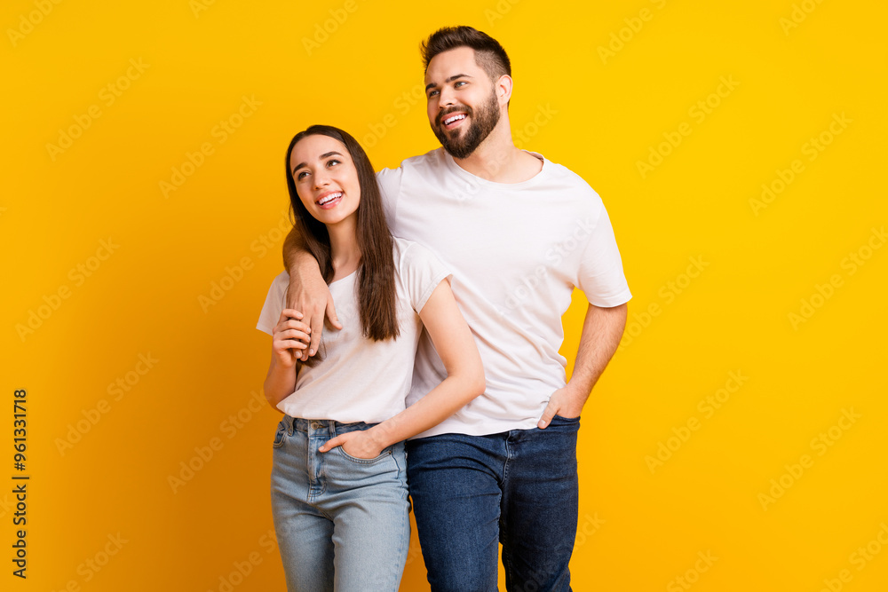 Canvas Prints Photo portrait of lovely young guy girl look empty space hugging dressed stylish white garment isolated on yellow color background