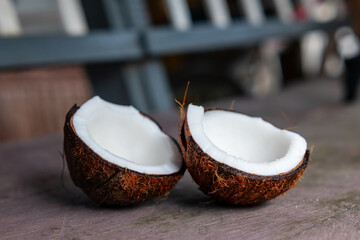 Split inner coconut fruit on stone