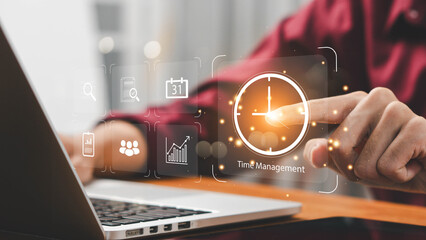 Time management concept, businessman holding clock and money icon on interface virtual for business time management. time is money, work planning increases efficiency and reduces work time.