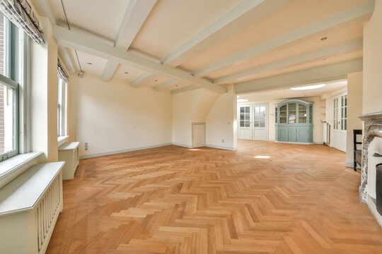 Spacious empty living room with hardwood floors