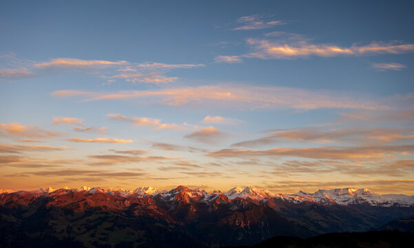 Sunrise over snowy Swiss Alps peaks, Bern Canton, Jaun