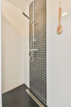 Modern shower with black and white tiles