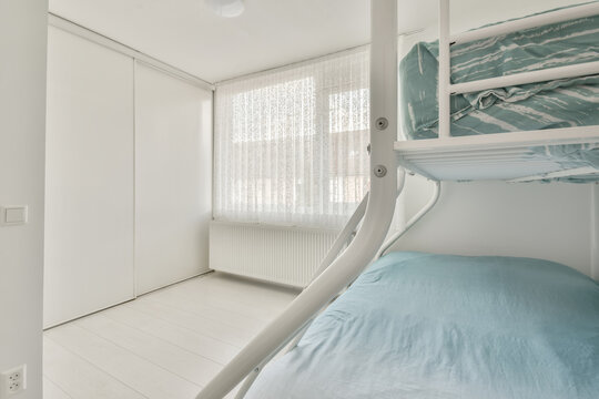 Simple modern bedroom with bunk bed and wardrobe