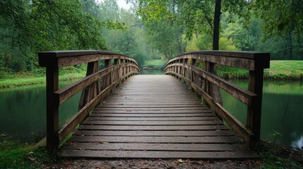 Obraz premium Wooden Bridge Over Tranquil Stream