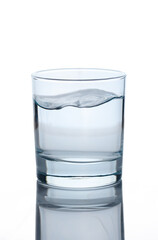 Pure drinking water in a glass or cup isolated on white background. High quality photo