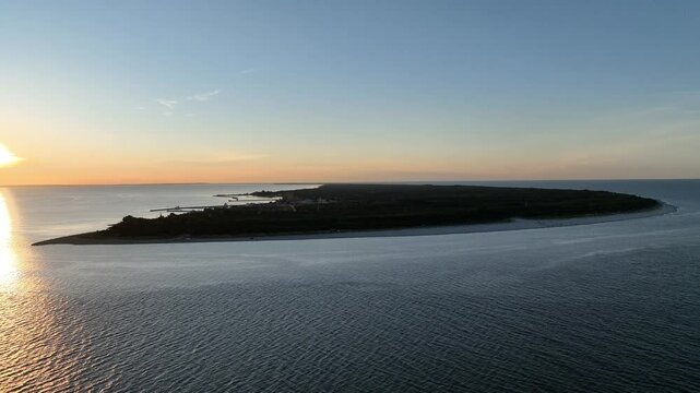 Hel city. Aerial view of Hel Peninsula in Poland, Baltic Sea and Puck Bay. Aerial video made by drone from above. End of poland hel peninsula. Hel beach in Poland. Sunset at sea and bay, Poland.