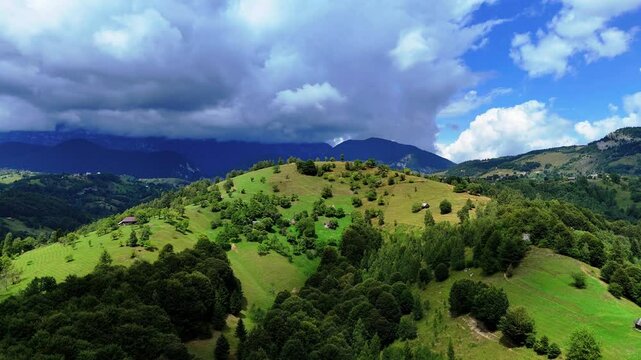 Aerial view of a grassy hill in the Romanian countryside near Pestera