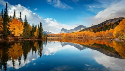 Scenic shot of a calm lake with fall reflections
