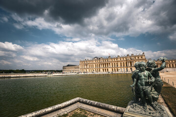 Dramatic Sky over the Water Parterre and Cherubs at Versailles Palace Gardens - France