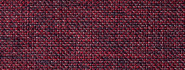 Texture dark red background from woven textile material with wicker pattern, macro. Vintage wine fabric cloth