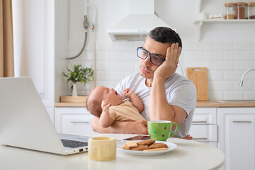 Sad tired exhausted father multitasking between business on computer and soothing baby using digital applications for remote job looks sleepy feeling fatigue in cozy kitchen at home