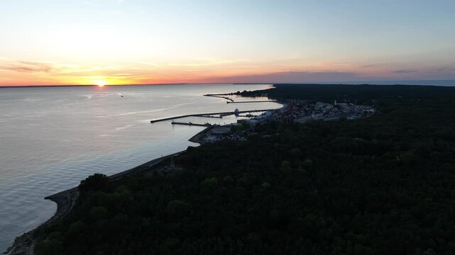 Hel city. Aerial view of Hel Peninsula in Poland, Baltic Sea and Puck Bay. Aerial video made by drone from above. End of poland hel peninsula. Hel beach in Poland. Sunset at sea and bay, Poland.