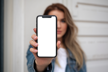Woman showing smartphone with blank screen isolated on transparent background