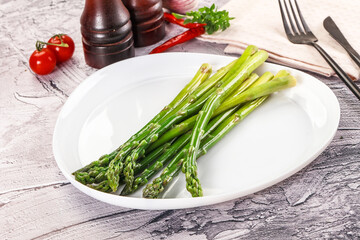 Vegan cuisine - Boiled asparagus with oil