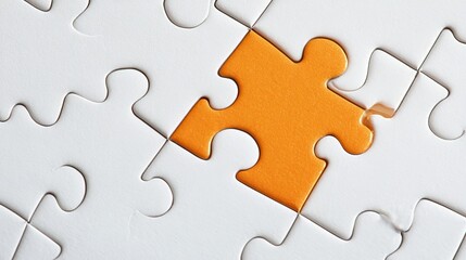 Fototapeta premium Orange Puzzle Piece in White Jigsaw