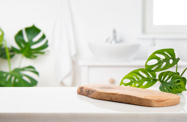 Wooden podium on table on blur bathroom background for bathing and spa product display